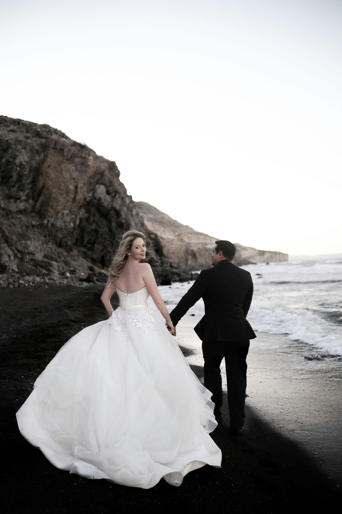 A couple on a dramatic stretch of South African coastline