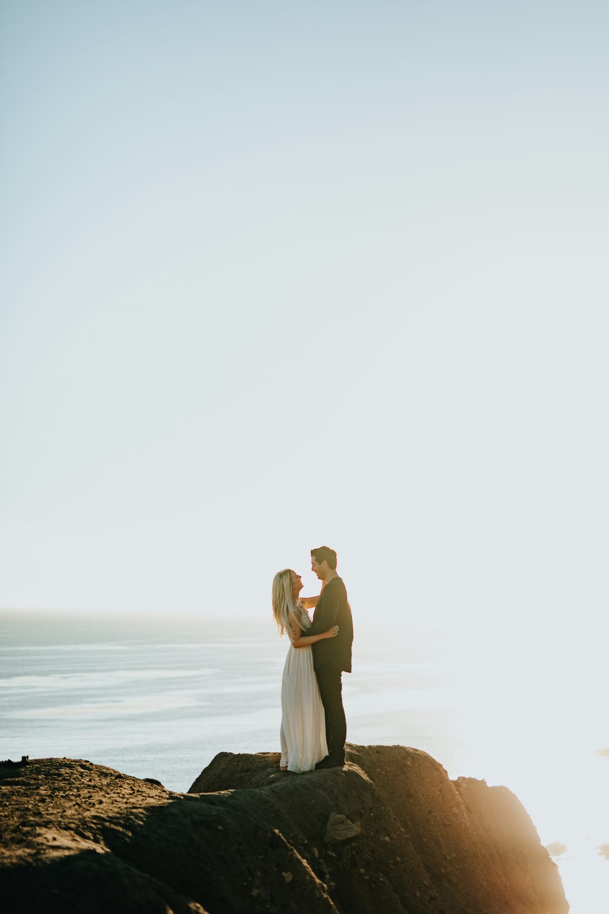 A couple on a dramatic stretch of South African coastline