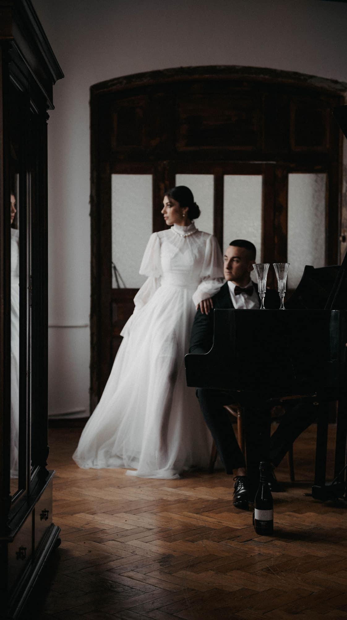 A bride standing beside her groom on their wedding day
